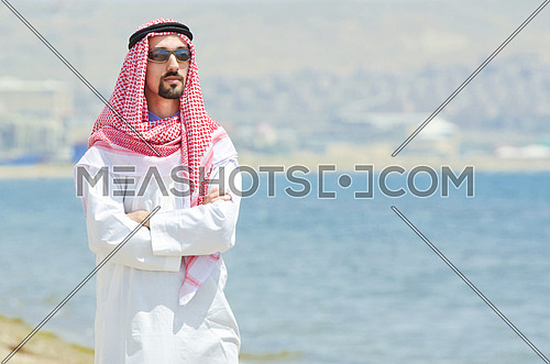Arab on seaside in traditional clothing