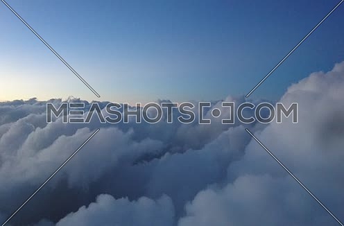 POV shot from plane front flying through clouds 