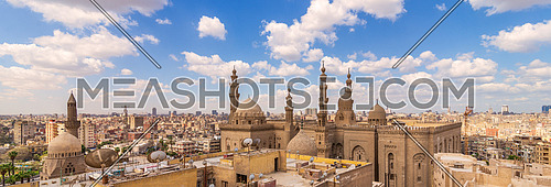 A panoramic shot of minarets and domes of Sultan Hasan Mosque and Al Rifai Mosque in Cairo, Egypt