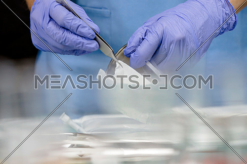 Nurse taking gauze sterile in a hospital, conceptual image