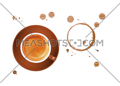 Brown cup full of espresso coffee on saucer, with ring coffee stains and drops isolated on white background, elevated top view, directly above