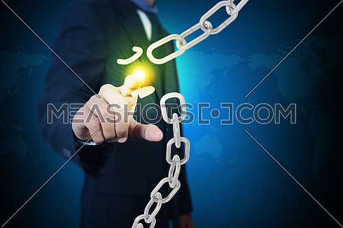 Business man with broken chain in color background