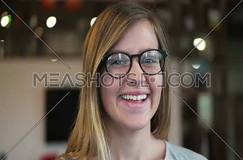 tracking shot of  Young Woman In A Startup Office