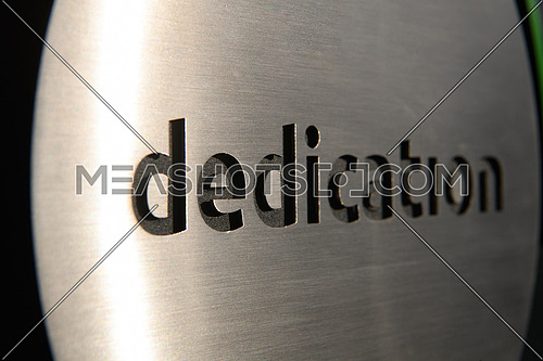 engraving a CNC machine on a piece of metal. Engraving dedication text. High quality photo