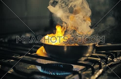 chef cooking pasta in a pan