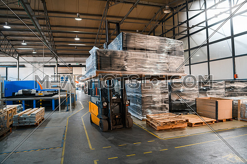 Forklift loader in storage warehouse shipyard. Distribution products. Delivery. Logistics. Transportation. Business background. High quality photo