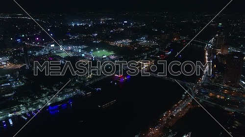 Fly over Cairo City showing the River Nile, Cairo Tower and Opera house at night - December 2018.