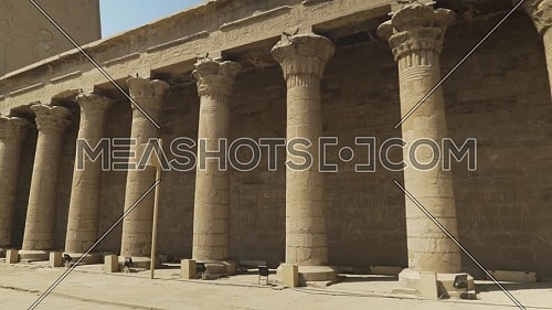 Follow shot for columns inside the Temple of Edfu Egypt by day