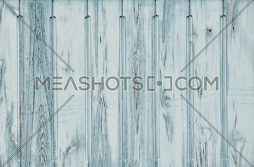 Light blue teal vintage old grunge aged painted wooden panel with vertical planks texture background with paint scaling