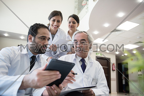 middle eastern doctors and medical staff at a meeting in a modern hospital