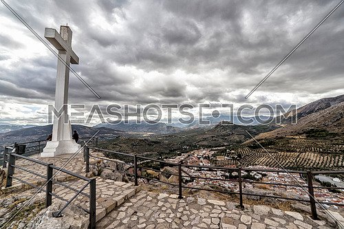 Landmark of walkway towards great crucifix in Santa Catalina or St Catherine mountain, public monument and lookout balcony over Jaen city, Andalusia, Spain