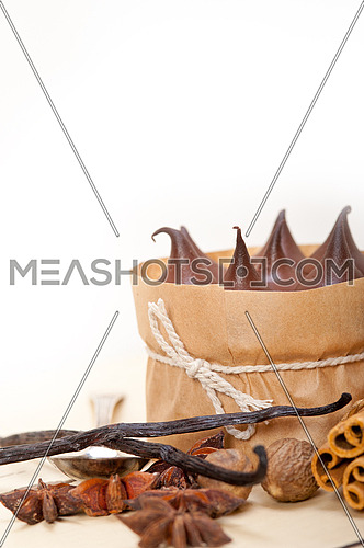 fresh baked chocolate vanilla and spices cream cake dessert over rustic wood table