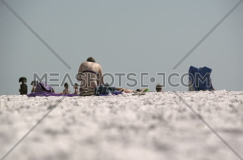 people sitting at the beach