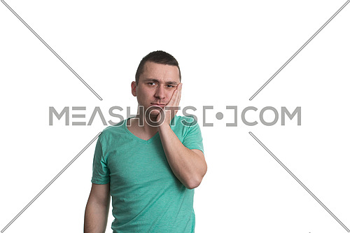 Portrait Of Young Man With Sensitive Tooth Ache Crown Problem , Suffering From Pain, Touching Outside Mouth With Hand, Isolated On White Background