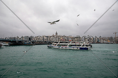 Istanbul, Turkey - December 30, 2019: View of the Bosphorus and ships and barges sailing through it.