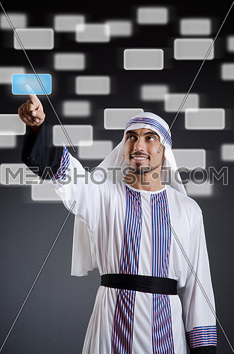 Arab businessman pressing virtual buttons