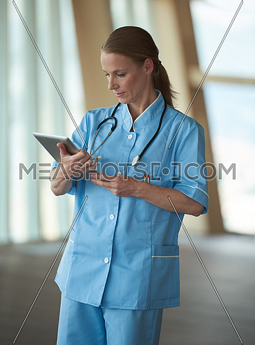 portrait of female doctor with  tablet computer at hospital