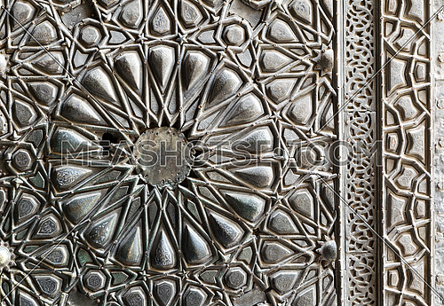 Ornaments of the bronze-plate ornate door of Sultan Barkouk Mosque, an ancient historic mosque in Old Cairo, Egypt