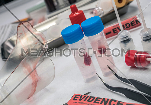 Swabs with blood sample to be analyzed in the laboratory, conceptual image