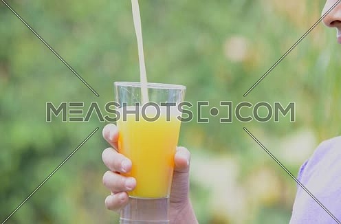 Orange juice poured in a glass