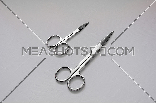 Various scissors on white background