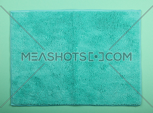 Close up teal blue microfiber washcloth, household cleaning wipe or towel background texture