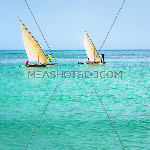 In the picture two traditional catamarans(Ngalawa) on amazing turquoise water in the Indian ocean.
