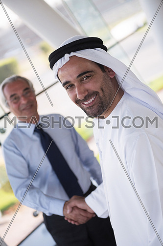 arabian businessman make deal and handshake with company director at modern meeting room