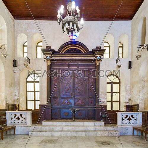 Wooden decorated entrance of historic Jewish Maimonides Synagogue or Rav Moshe Synagogue with arched windows and chandelier in Gamalia district, Cairo Egypt