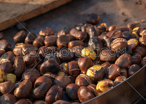 Roast chestnuts cooked over the red-hot grill,