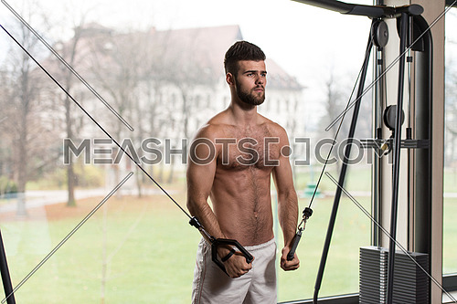 Handsome Man Is Working On His Chest With Cable Crossover In A Modern Gym