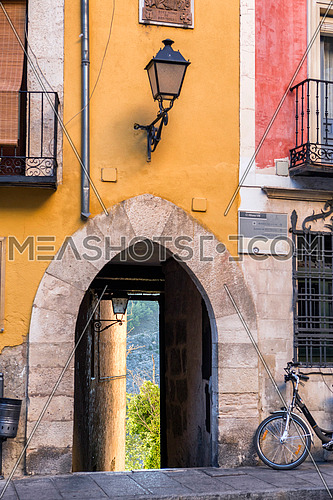 Arch of entry to a street close to the cathedral of Cuenca to the evening, Cuenca, Spain