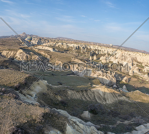 Goreme, Turkey - April 23, 2019: Rural Cappadocia landscape. Stone houses of Cappadocia.