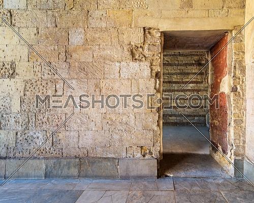 Bricks stone wall with opening revealing vacant room with bricks wall, Old Cairo, Egypt
