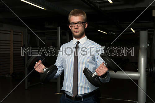 Businessman Working Out Biceps - Dumbbell Concentration Curls