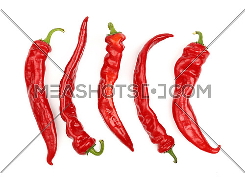 Group of whole fresh red hot chili peppers isolated on white background, close up, elevated top view, directly above