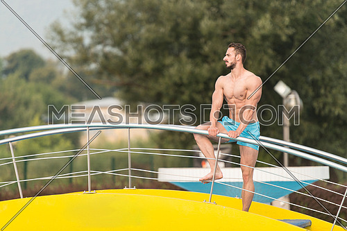 Portrait Of A Very Muscular Sexy Man In Underwear Resting At Swimming Pool