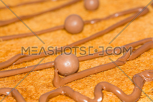 A close up shot of kunafa with chocolate topping ramadan dessert