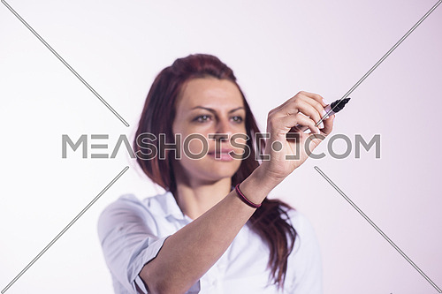 Middle eastern  business woman writing with marker on virtual screen isolated on white background
