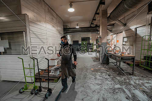 the worker preparing for a working day in a modern metal production and processing factory. High quality photo