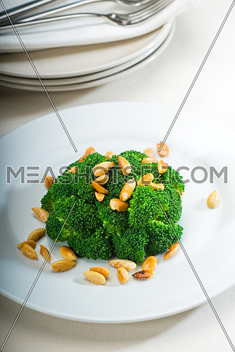 fresh and vivid sauteed broccoli and almonds very ealthy food