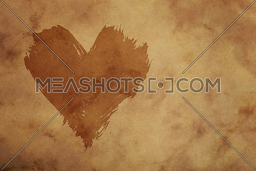 Dark painted heart with brushstroke shape over grunge brown paper background