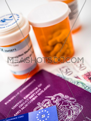 British passport along with several bottles of medicines, concept of medical increase in the crisis of the brexit, conceptual image