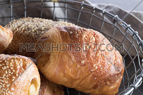 Pastry with crusted cheese on top in a basket
