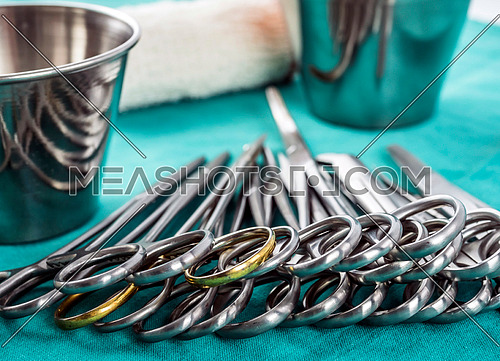 Scissors surgical in an operating theater, composition horizontal, conceptual image