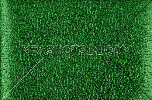 Close up background texture pattern of dark green natural leather grain, directly above