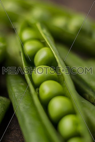 A close up on an opened RAW pea