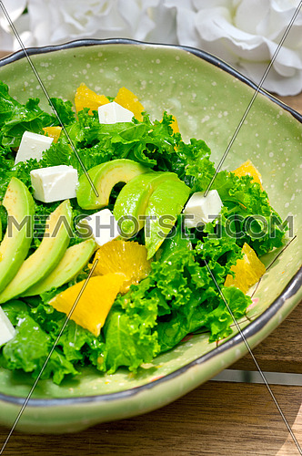 fresh avocado salad with orange pulp and feta cheese