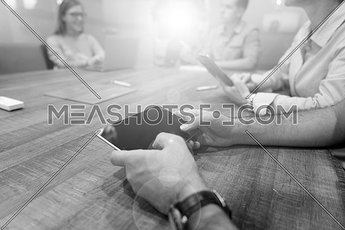 close up of businessman hands using tablet computer  on start up business meeting