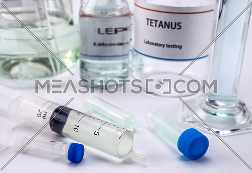 Test tetanus in laboratory, Syringe with medication for sampling, conceptual image, composition horizontal